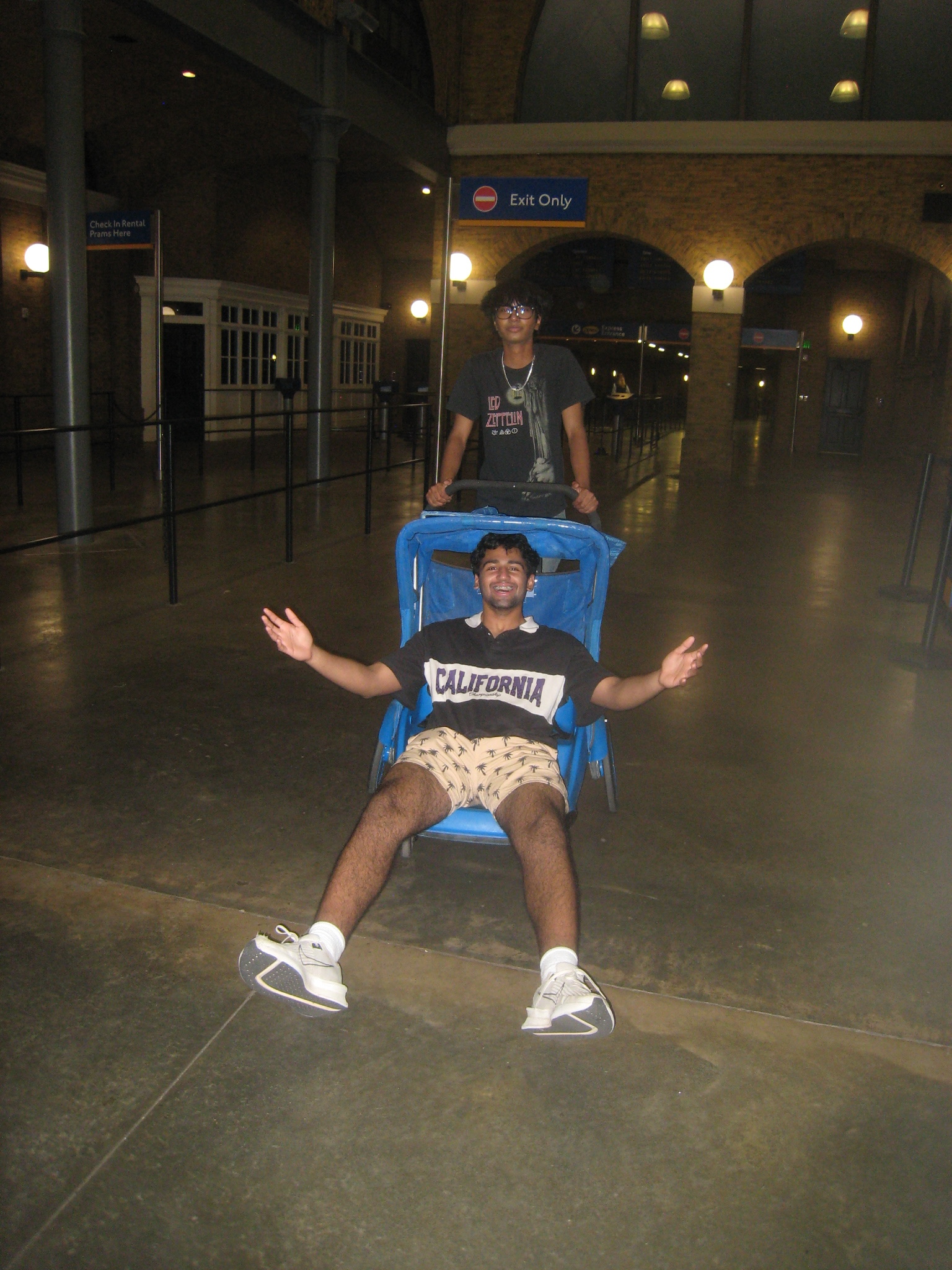 Sakethram relaxing in a chair with a friend behind him